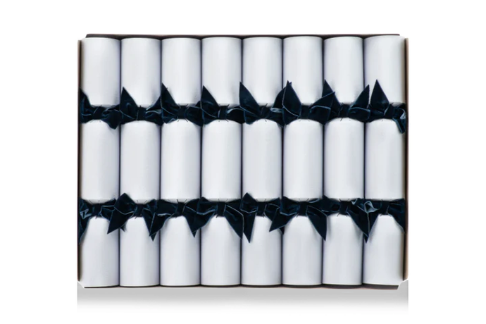 White Christmas crackers with dark blue bow